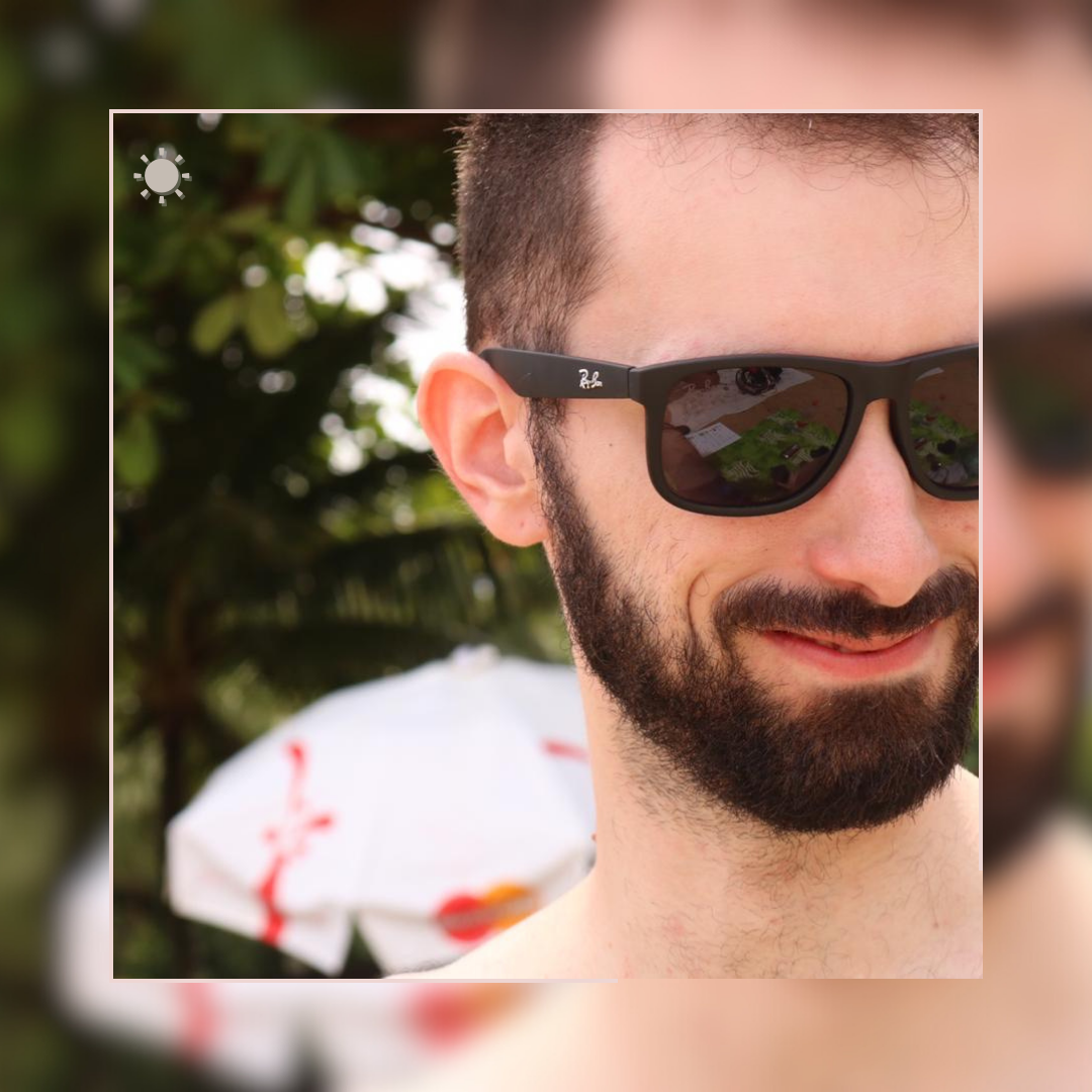 Picture of a man smiling with sunglasses